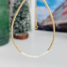 Load image into Gallery viewer, Delicate gold bracelet with natural shell beads
