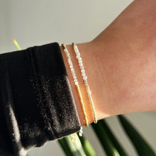 Load image into Gallery viewer, Delicate gold bracelet with natural shell beads