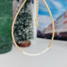 Load image into Gallery viewer, Delicate gold bracelet with natural shell beads