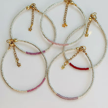 Load image into Gallery viewer, Gold bracelets with coloured accents (pinks, purples &amp; reds)
