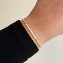 Load image into Gallery viewer, Delicate gold bracelet with natural shell beads
