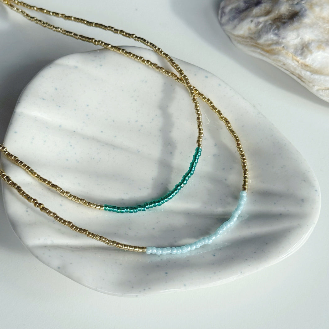 Gold and ocean blue necklaces