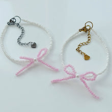 Load image into Gallery viewer, Pink bow bracelets with a pearl bead centre
