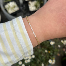 Load image into Gallery viewer, Delicate gold bracelet with natural shell beads

