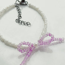 Load image into Gallery viewer, Iridescent purple bow bead bracelet
