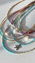 Load image into Gallery viewer, Gold and ocean blue necklaces
