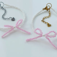 Load image into Gallery viewer, Pink bow bracelets with a pearl bead centre
