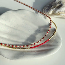 Load image into Gallery viewer, Gold glass bead necklace with ruby red accent
