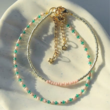 Load image into Gallery viewer, Gold bracelets with coloured accents (pinks, purples &amp; reds)
