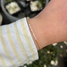 Load image into Gallery viewer, Delicate gold bracelet with natural shell beads
